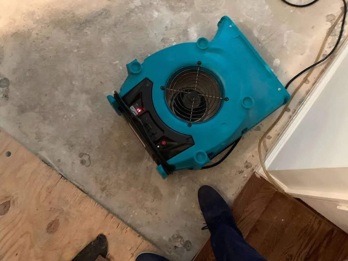 Air mover drying subfloor during Commercial Water Damage Restoration in Apache Junction